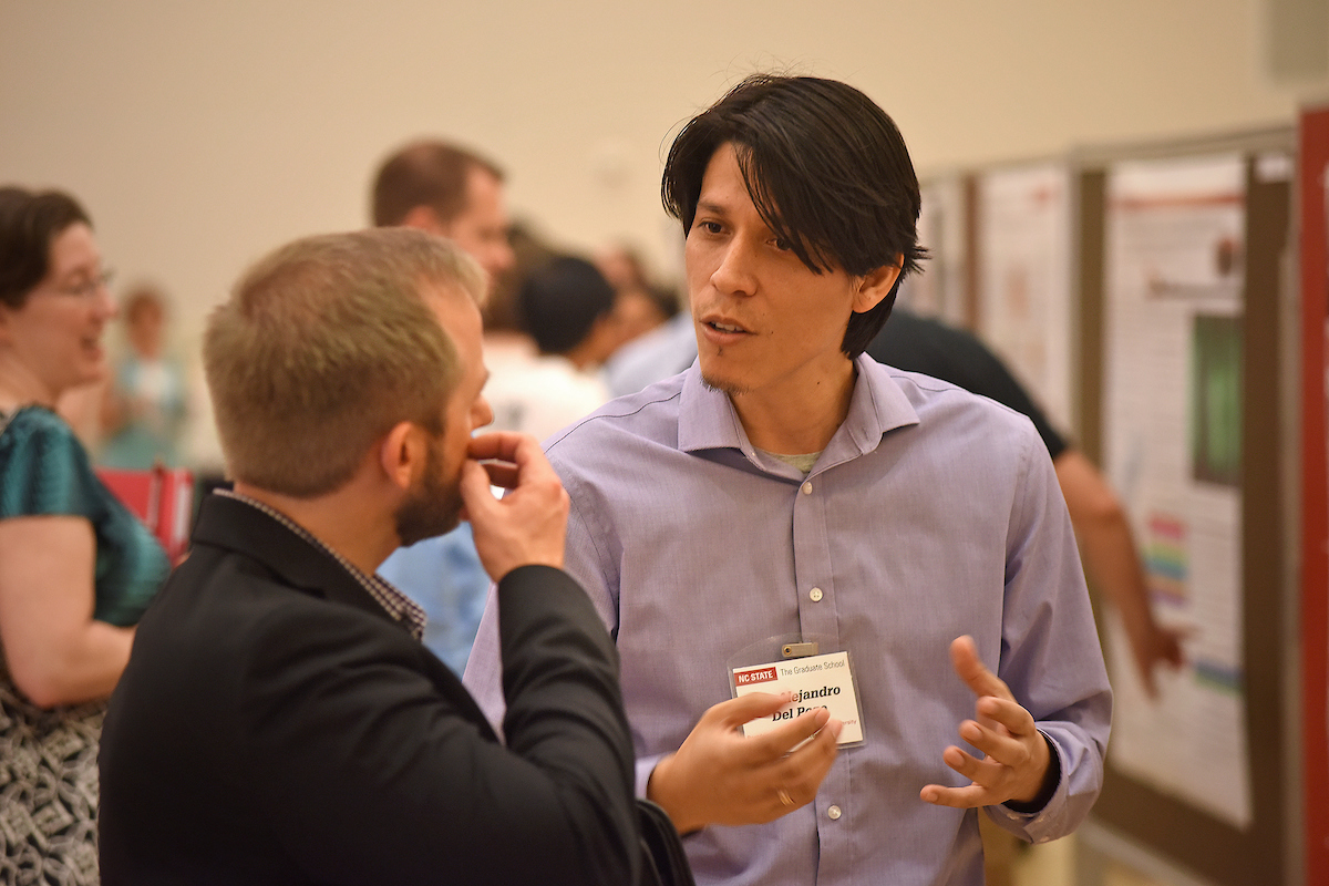 postdocs discussing a presentation